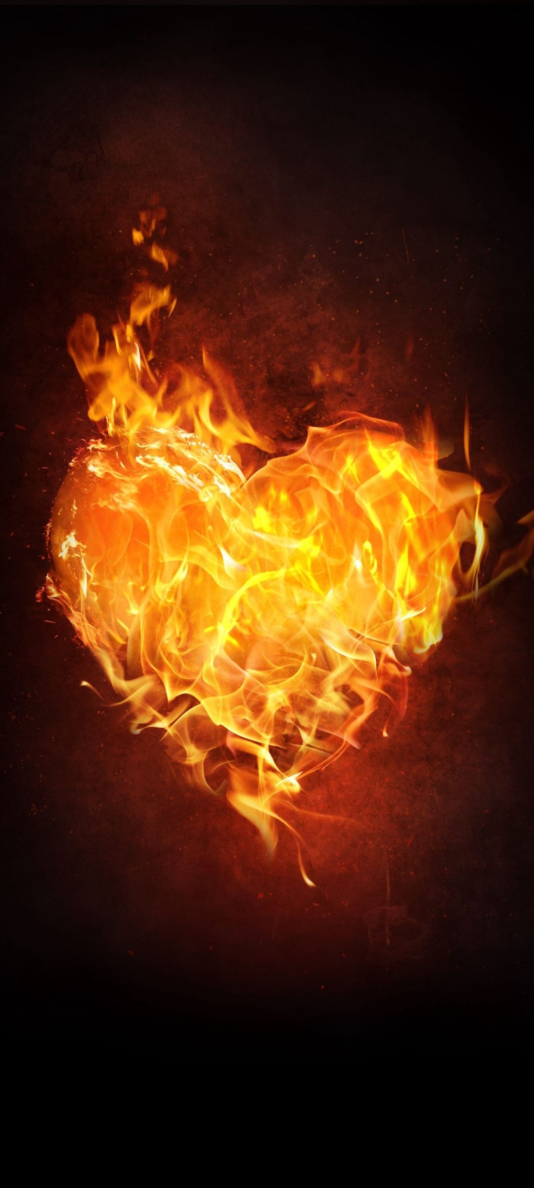 Heart shape engulfed in vibrant orange and yellow flames against a solid black background with glowing embers.