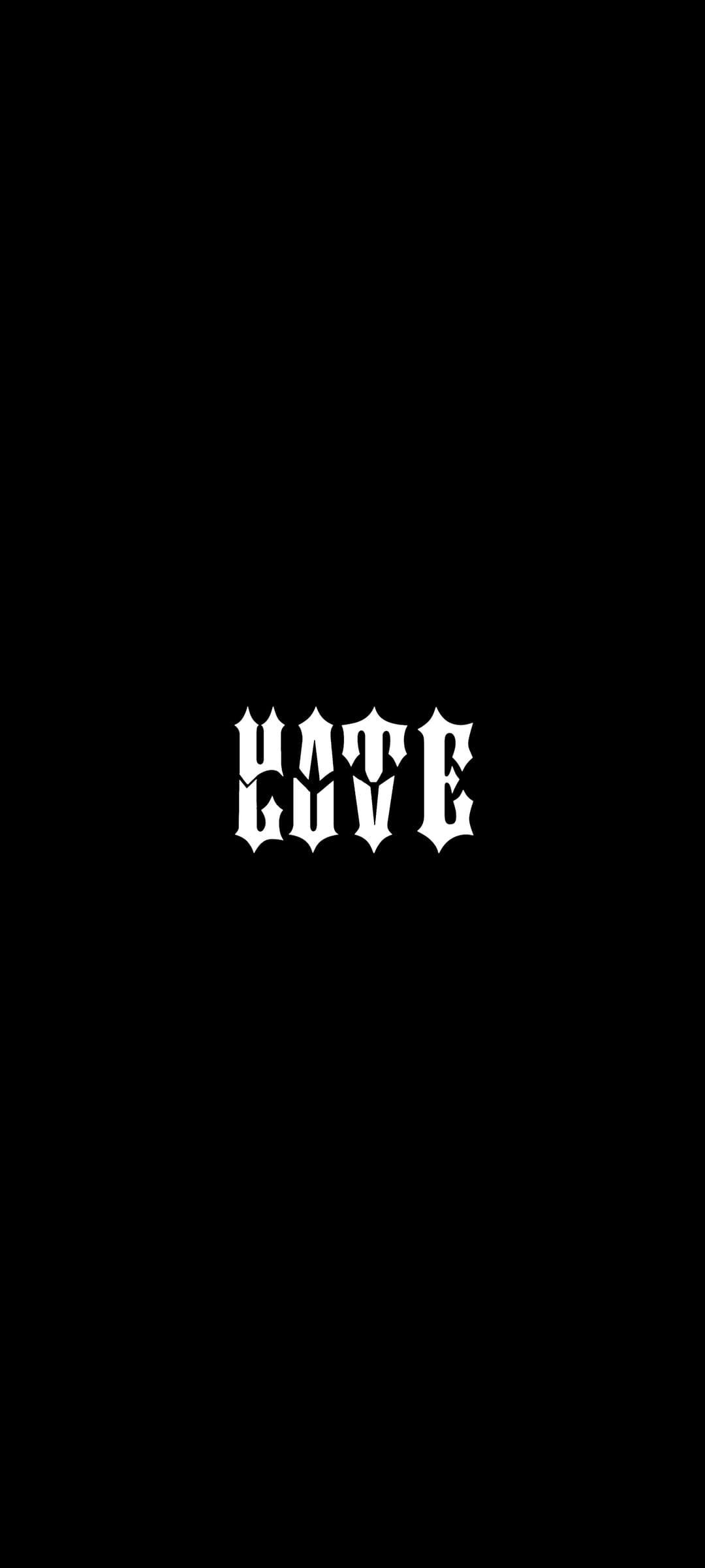 White gothic lettering spelling HATE centered against a solid black background with sharp calligraphic serifs.