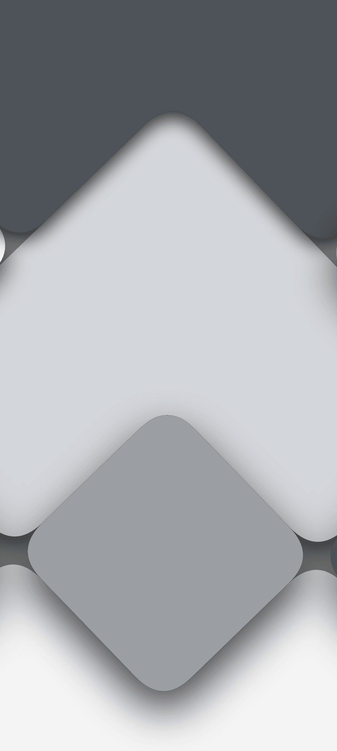 Overlapping rounded geometric shapes in shades of gray and white with soft drop shadows creating depth and layers.