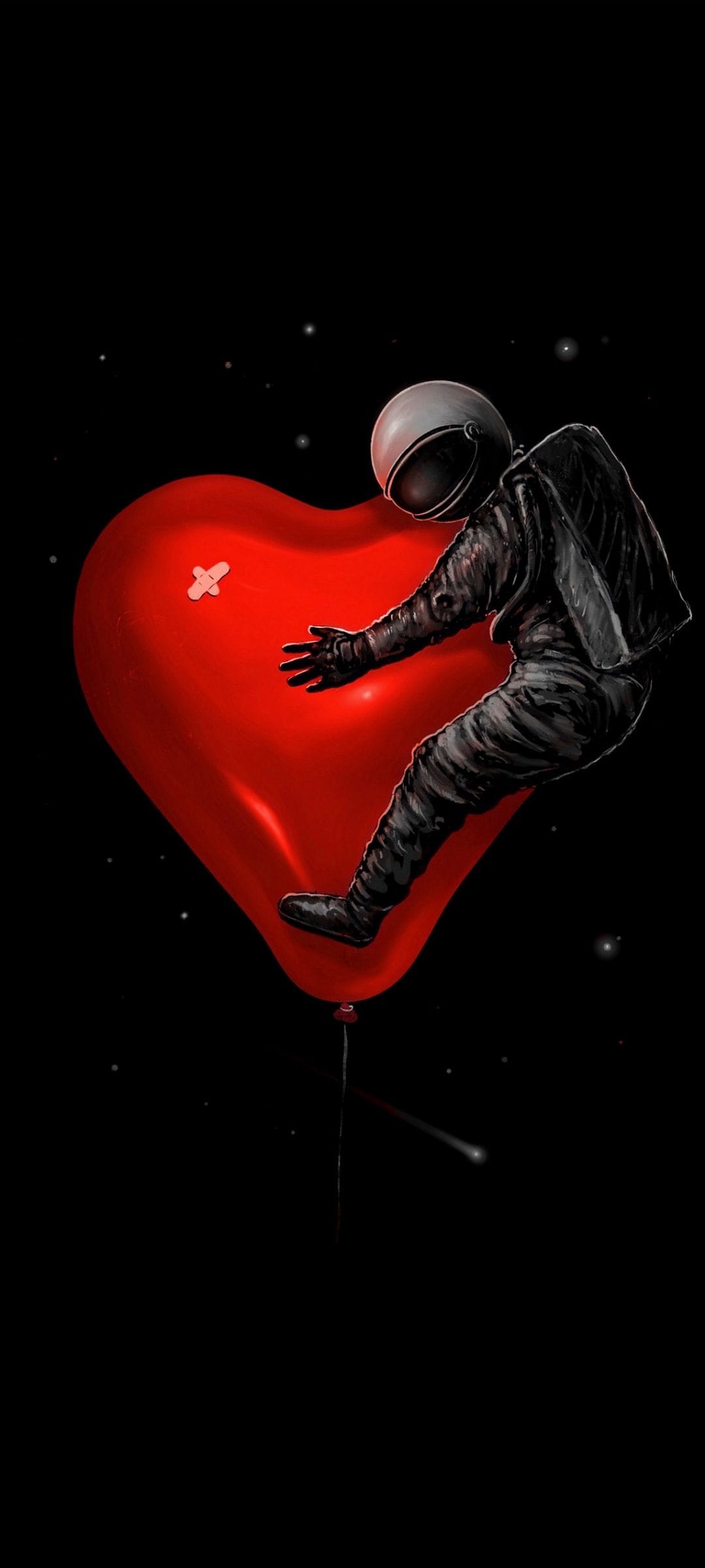 Astronaut in a white suit hugs a red heart-shaped balloon with a small bandage against a starry black sky.