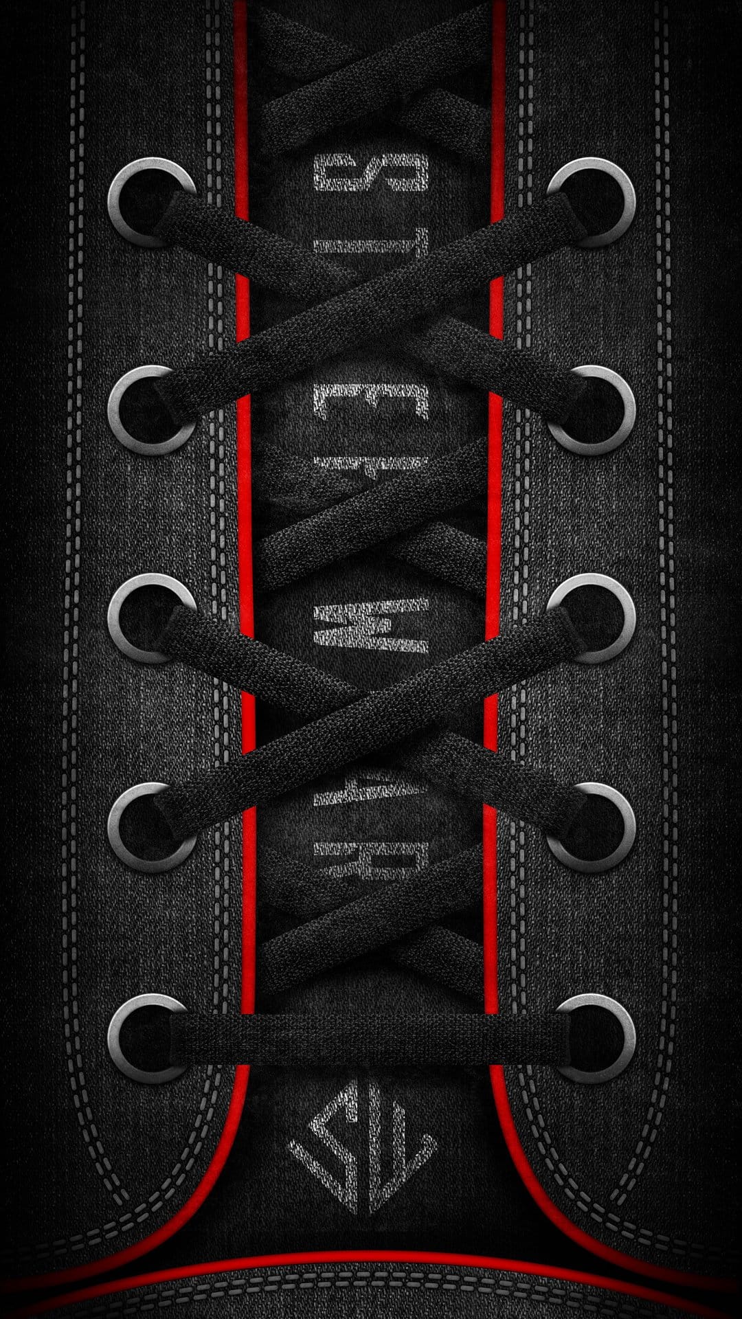 Black sneaker laces with red tips weave through silver eyelets on a dark fabric tongue with detailed stitching.