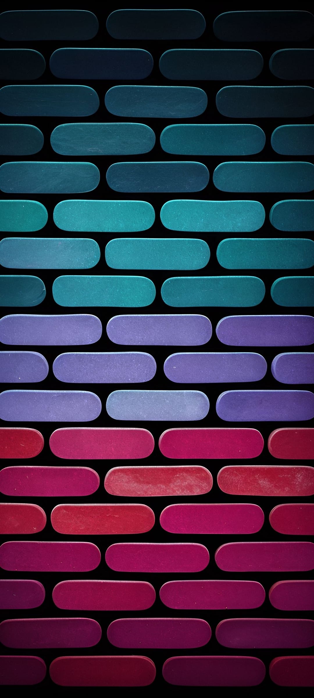 Vertical rows of staggered rounded rectangles in blue, purple, and red gradients on a solid black background.