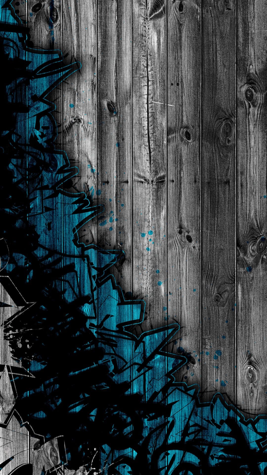 Teal and black graffiti splashes over vertical weathered gray wooden planks with detailed grain textures.