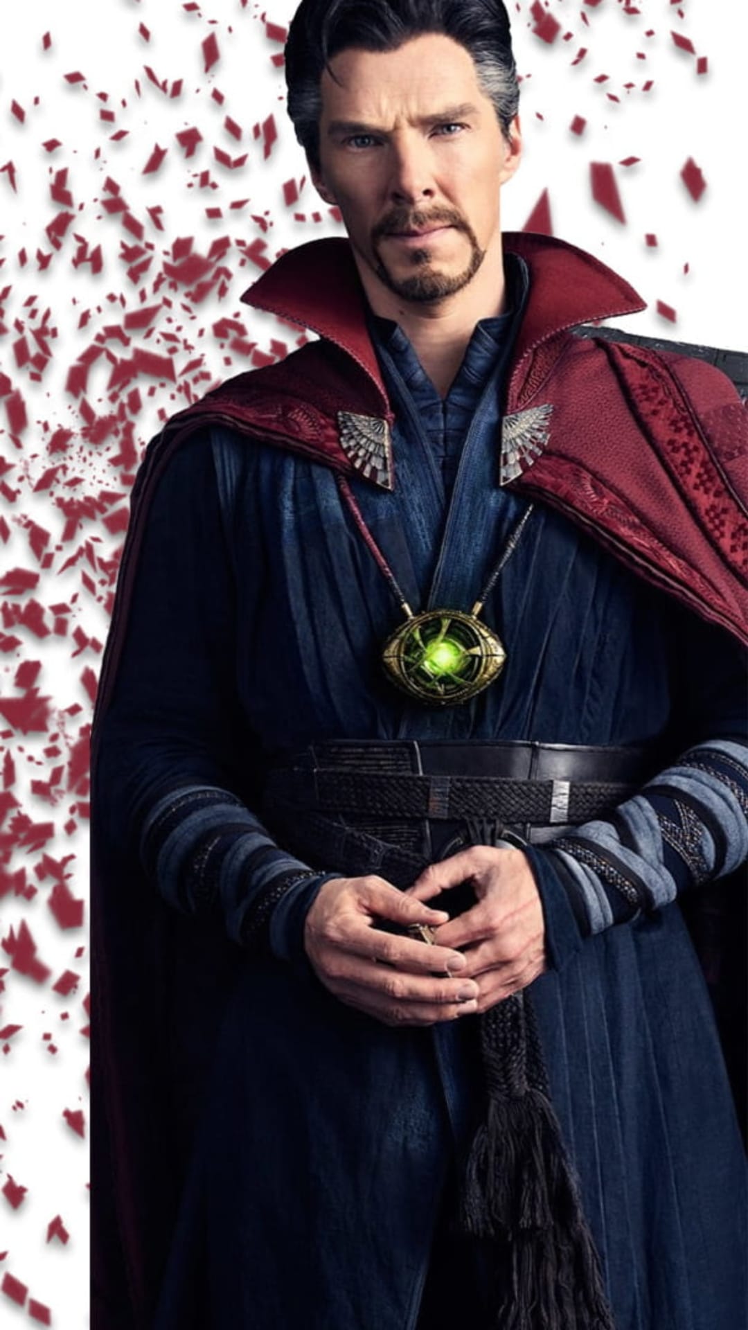Doctor Strange wearing a red cloak and golden eye amulet surrounded by swirling crimson and orange magic sparks.
