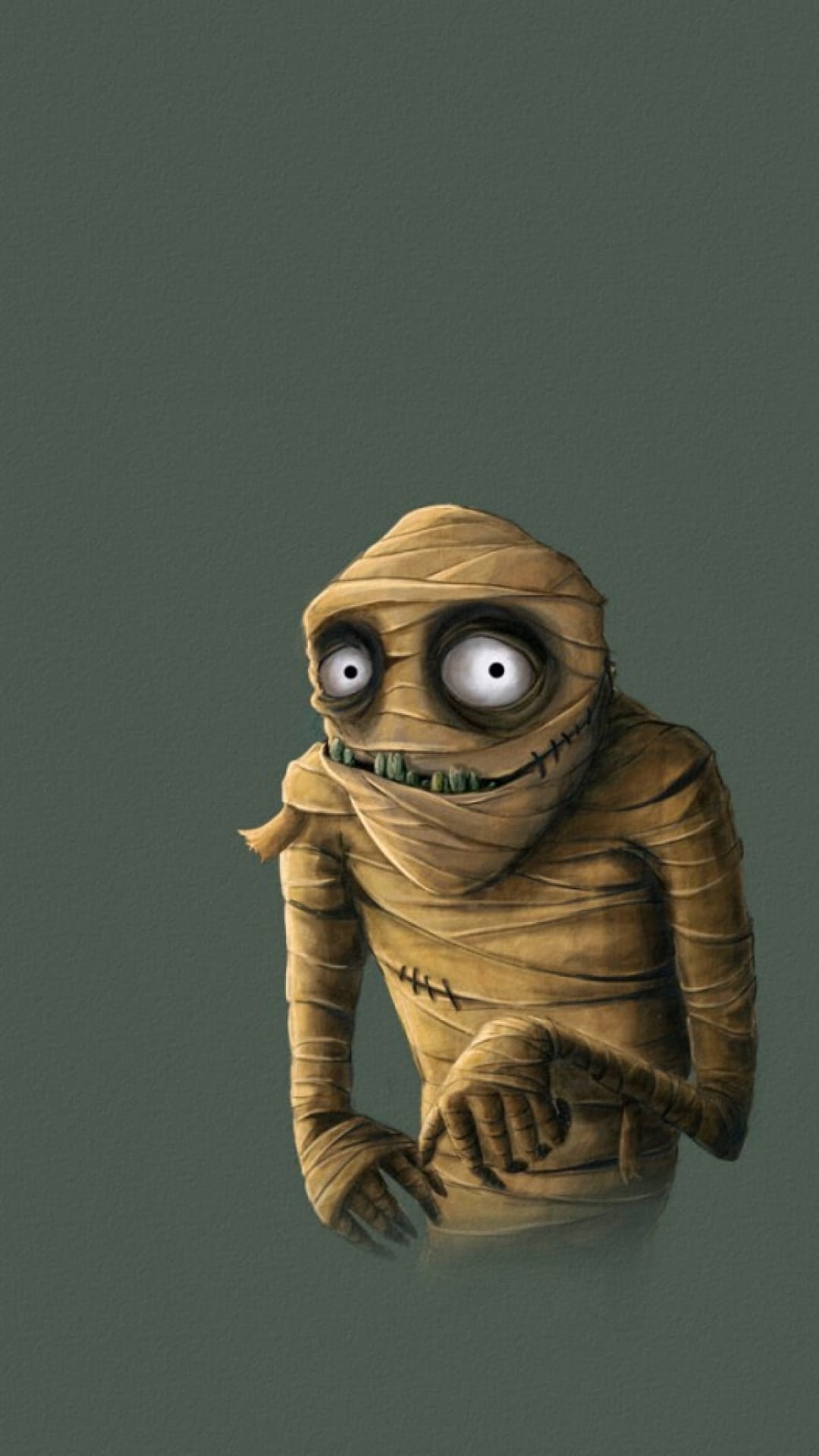 Grinning mummy with large white eyes and green teeth wrapped in tan bandages against a muted green background.