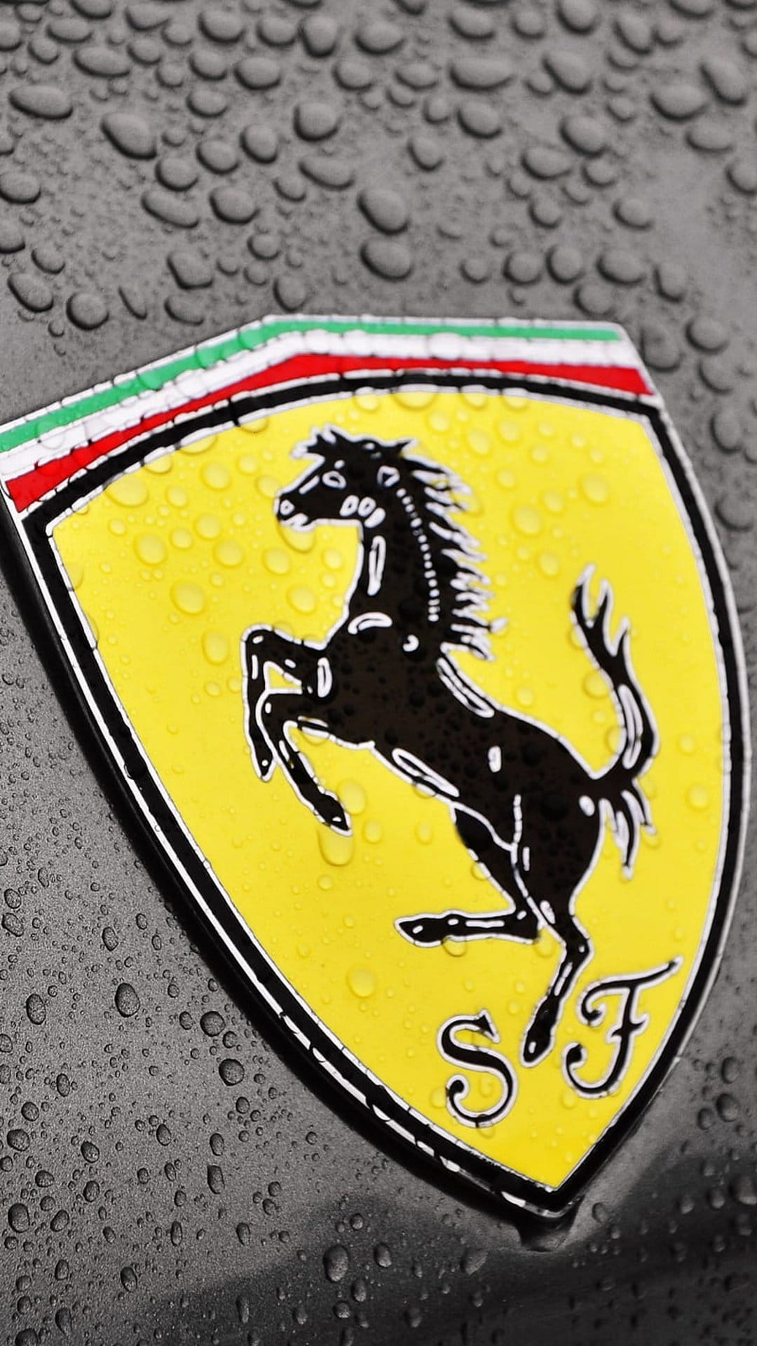 Ferrari prancing horse shield covered in water droplets against a dark textured surface with Italian flag details.