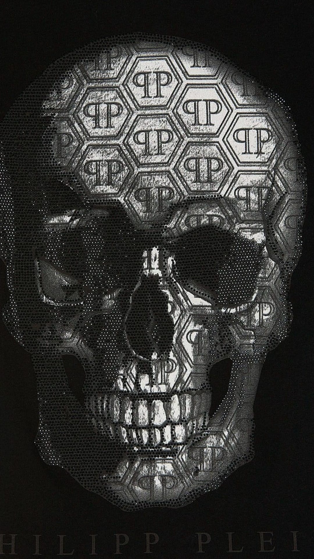 Silver metallic skull with hexagonal patterns and studded details on a black background for a luxury look.