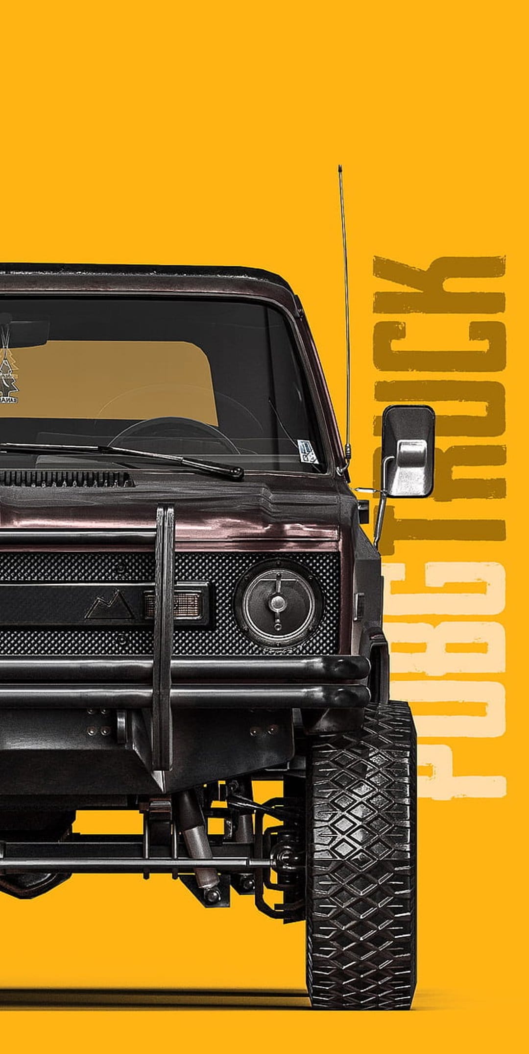 Tactical off-road truck with reinforced bumpers and large tires parked on a dusty, desolate battleground.
