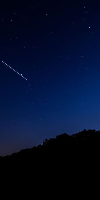 Night sky, Stars, Meteor, Shooting star, Nature, Silhouette, Sky, Cosmic, Celestial, Outdoors, Serene, Dark, Landscape, Astrophotography, Trail, Luminous, Peaceful, Universe, Wonder, Evening