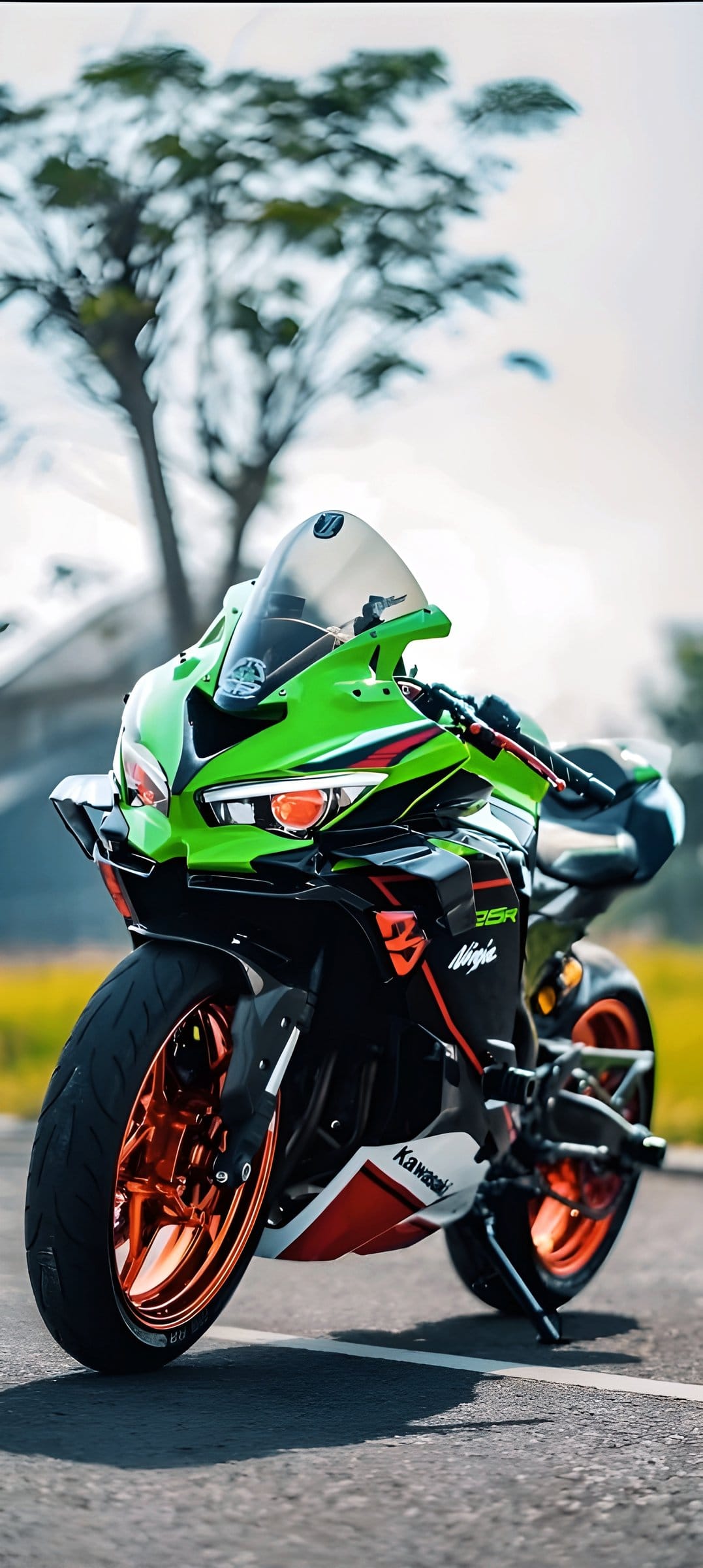 Kawasaki Ninja ZX-10R motorcycle with orange rims and green bodywork parked on a paved road under a bright sky.