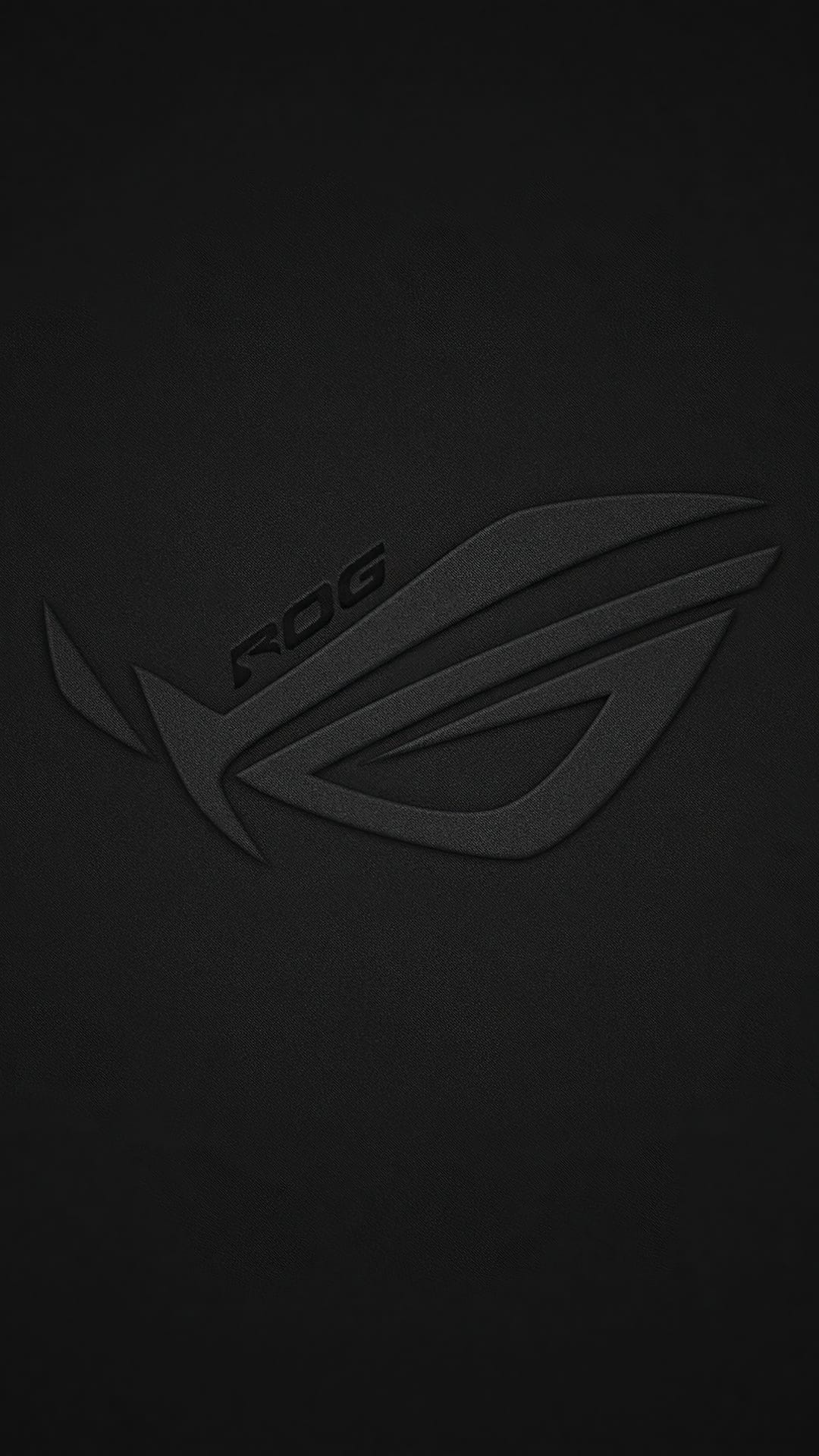 Republic of Gamers logo embossed in matte black on a grainy charcoal surface for a minimalist phone background.
