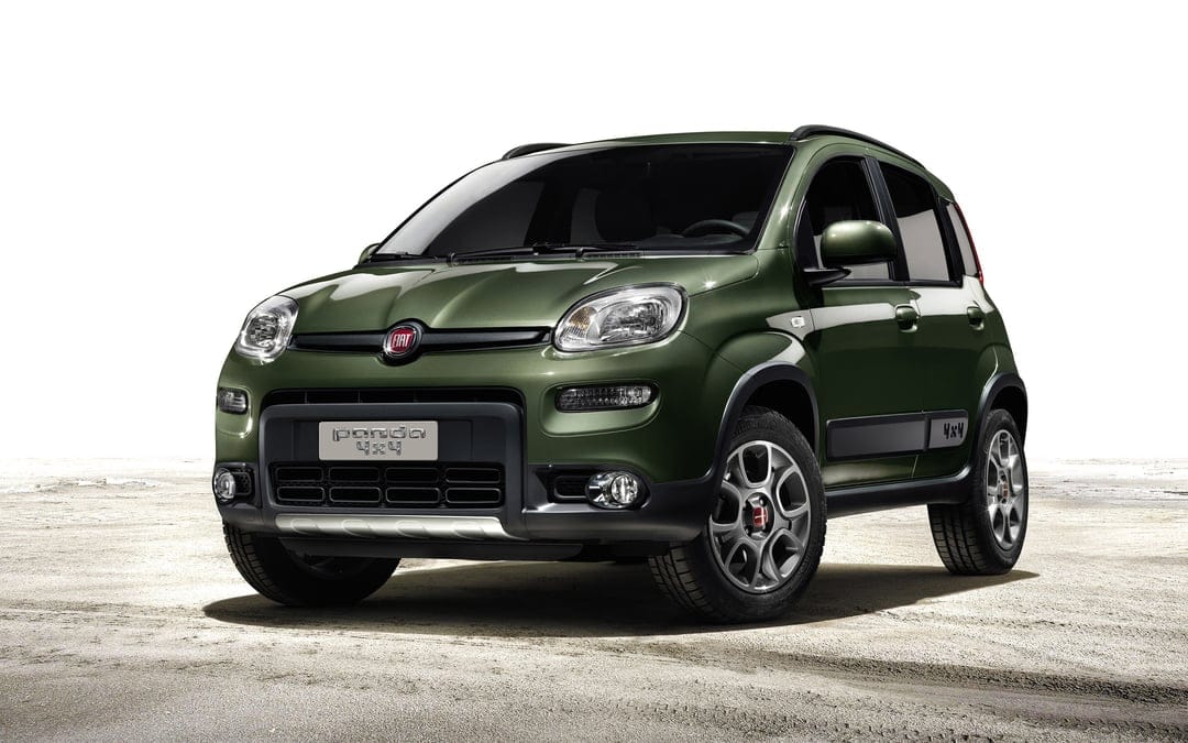 Fiat Panda 4x4 car in metallic green parked on a dirt ground against a bright white background.