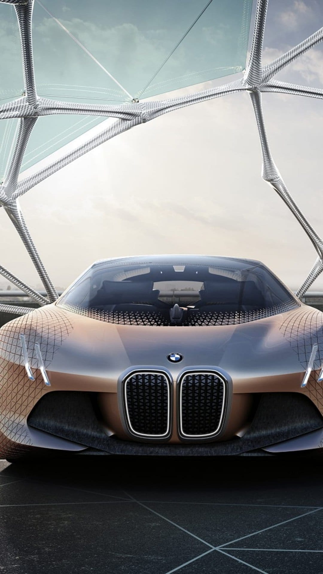 BMW Vision Next 100 concept car features a bronze metallic body and scale-like skin over the front wheels.