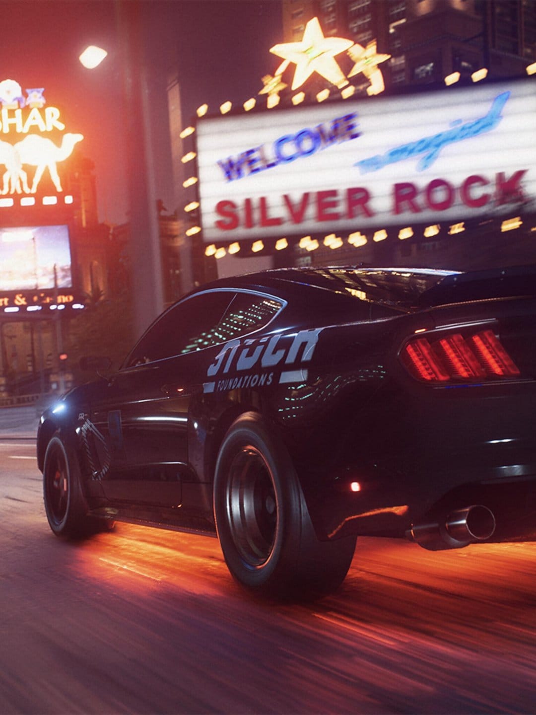 Black muscle car with orange underglow speeds past neon signs on a city street at night with heavy motion blur.