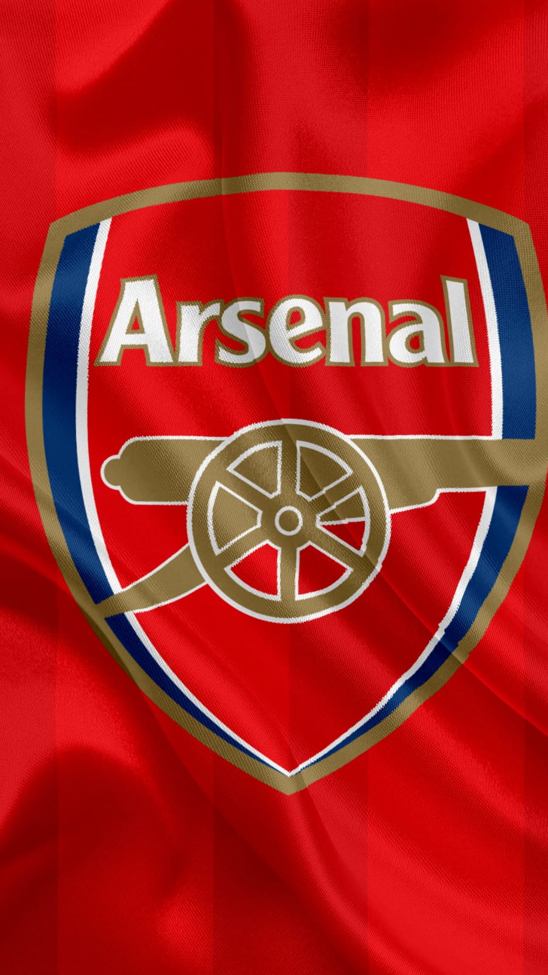 Arsenal Football Club crest with a gold cannon and white text on a textured red jersey fabric background.