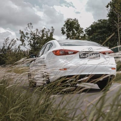 mazda 3, mazda, car, white, rear view, grass, trees, mobile wallpaper, android wallpaper, iPhone wallpaper, phone wallpaper