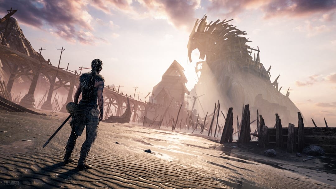 A female warrior looks at a massive wooden horse structure on a misty beach with golden light rays.