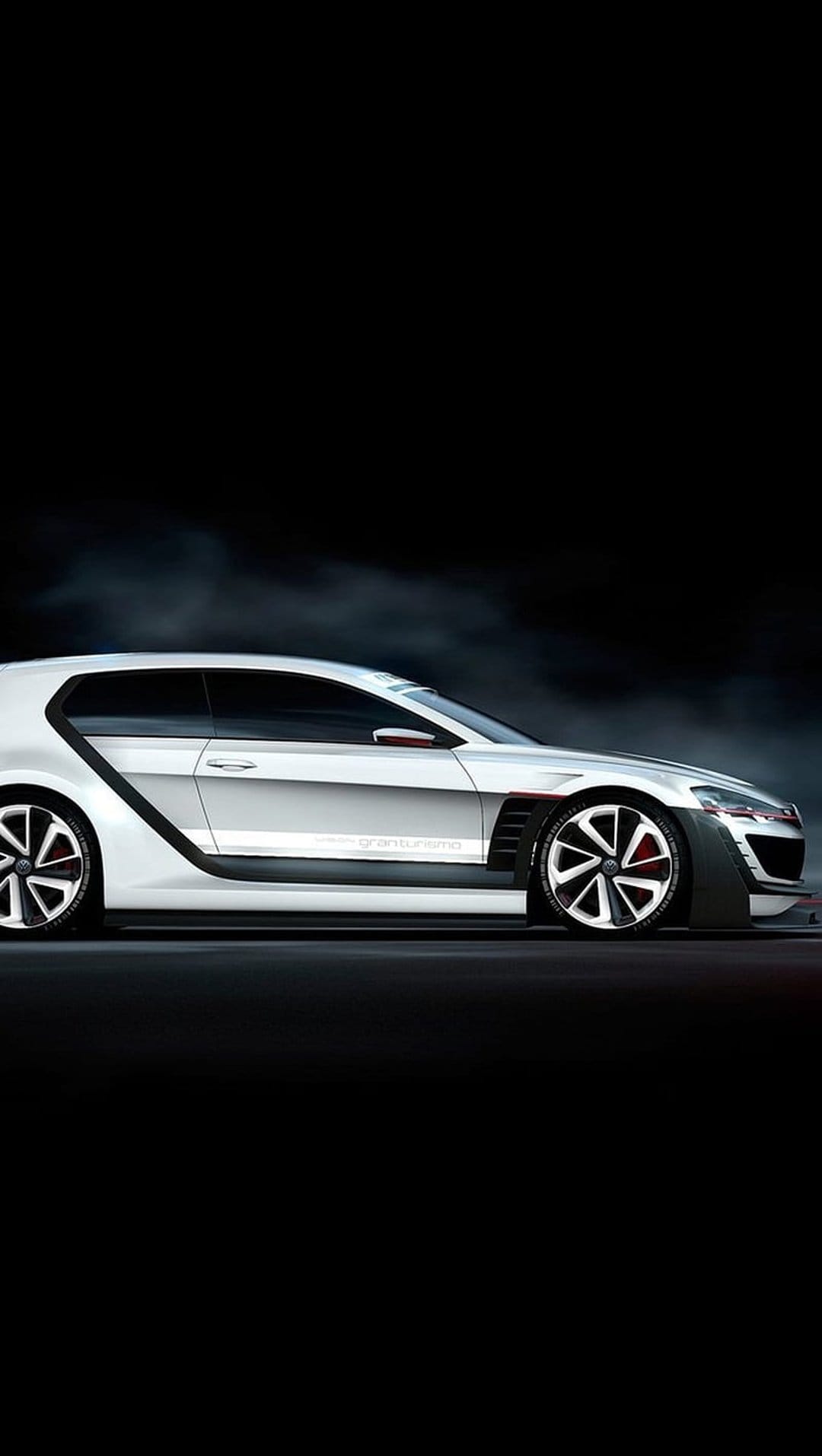 White VW GTI Clubsport concept car features aerodynamic curves and large rims against a misty black background.