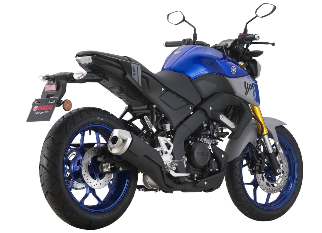 Blue Yamaha MT-15 motorcycle with golden forks and blue rims on a white background from a rear three-quarter view.