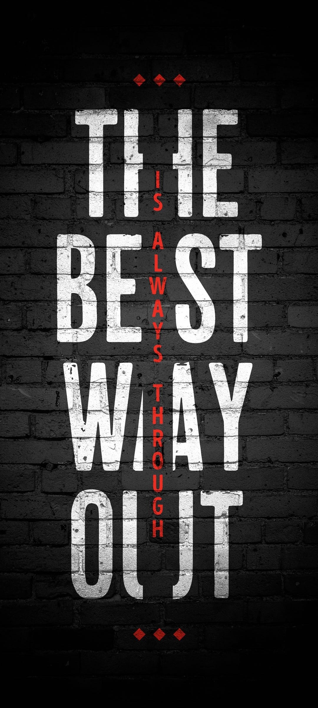 White and red motivational text stands against a weathered red brick wall in this vertical screen background.