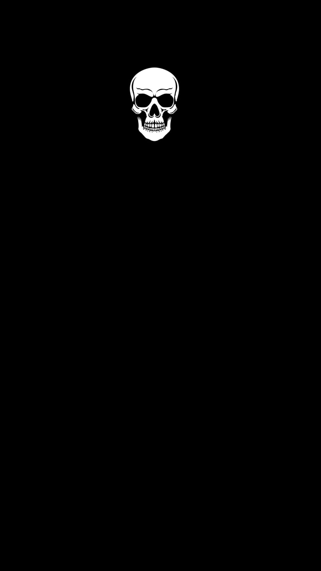 White human skull with hollow eye sockets centered on a solid pitch-black backdrop for a minimalist aesthetic.