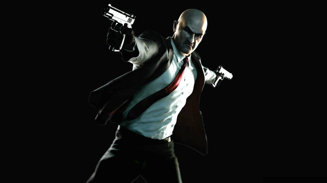 Bald assassin in a black suit and red tie aims dual silver pistols against a high-contrast black background.