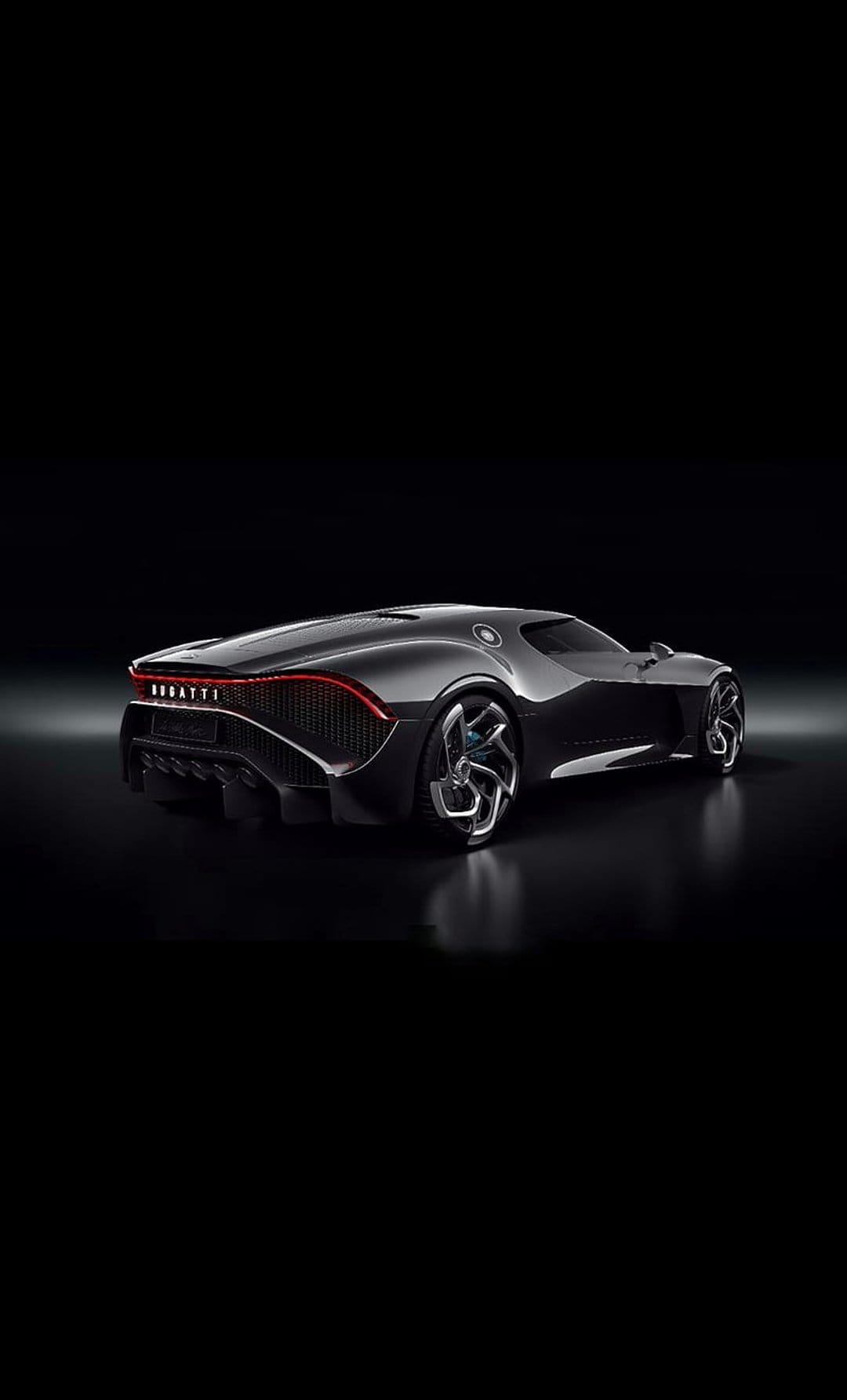 Bugatti La Voiture Noire hypercar featuring obsidian carbon fiber bodywork and distinctive rear light signature.