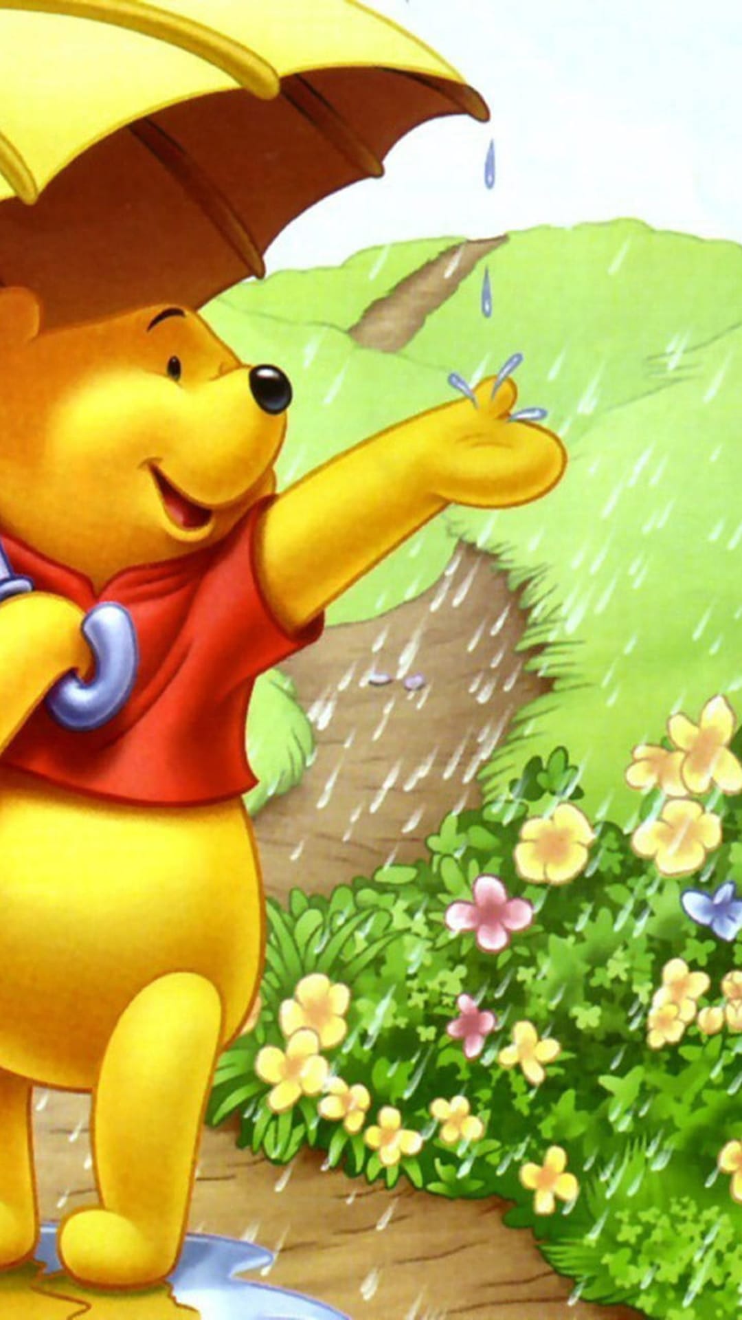 Winnie the Pooh holds a yellow umbrella and reaches for raindrops amidst green grass and spring flowers.