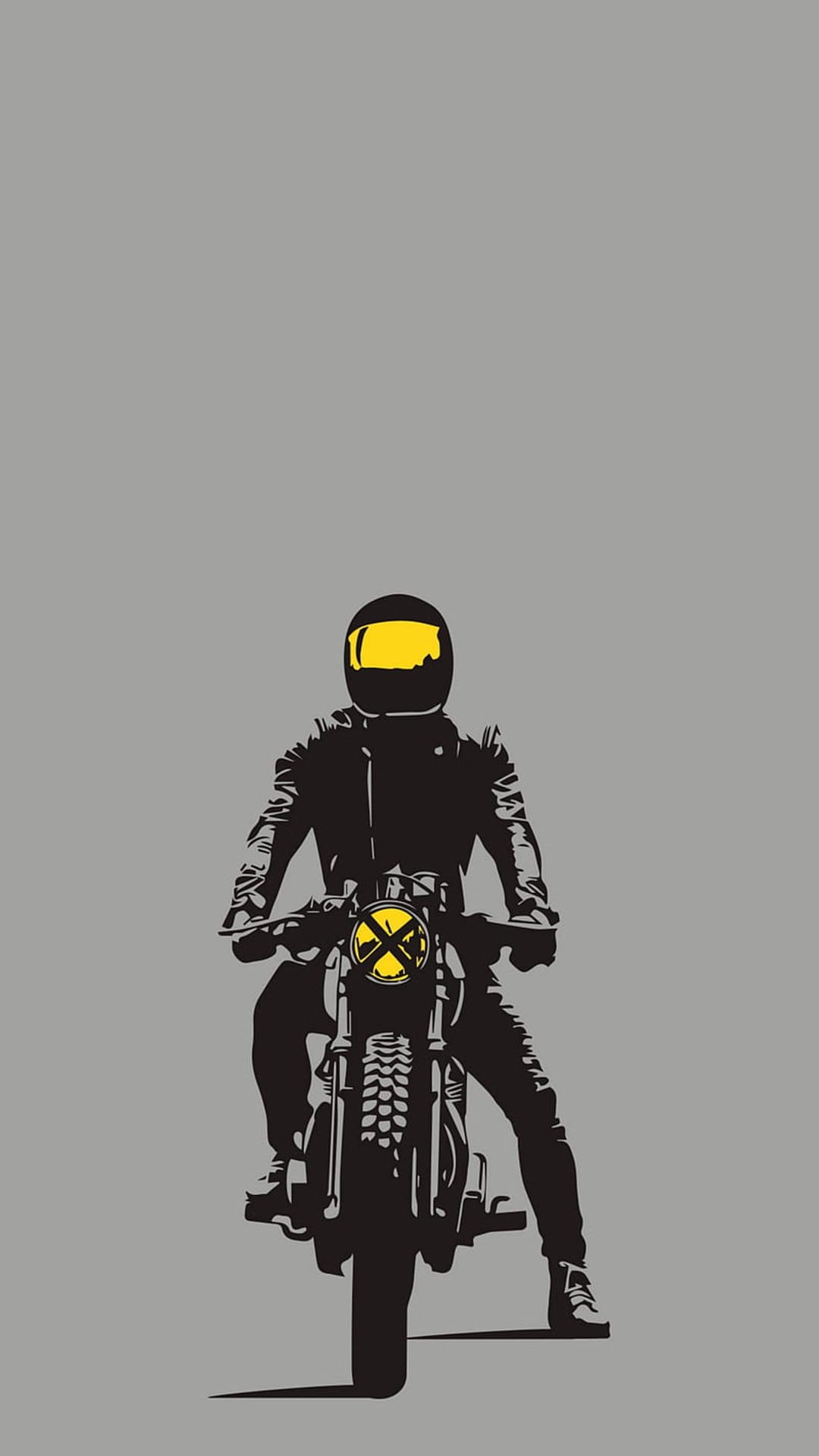 Motorcyclist in a black leather jacket and yellow helmet sits on a bike with a yellow circular headlight.
