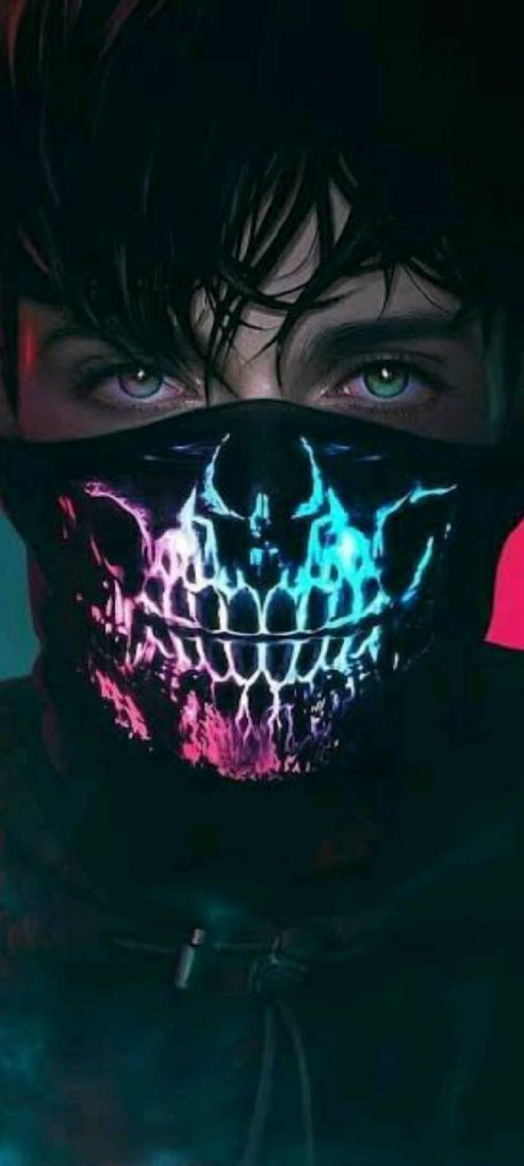 Man wearing a neon pink skull face mask with intense blue-green eyes and dark messy hair against a dark background.