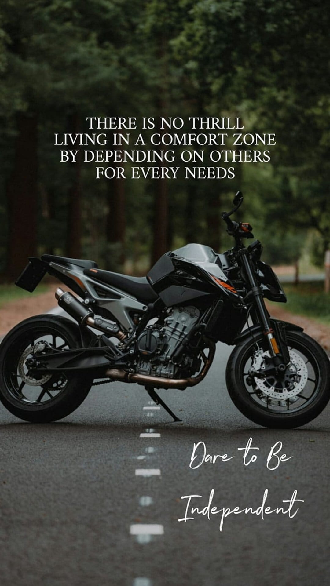 Black motorcycle on a forest road with white typography about independence and moving beyond comfort zones.