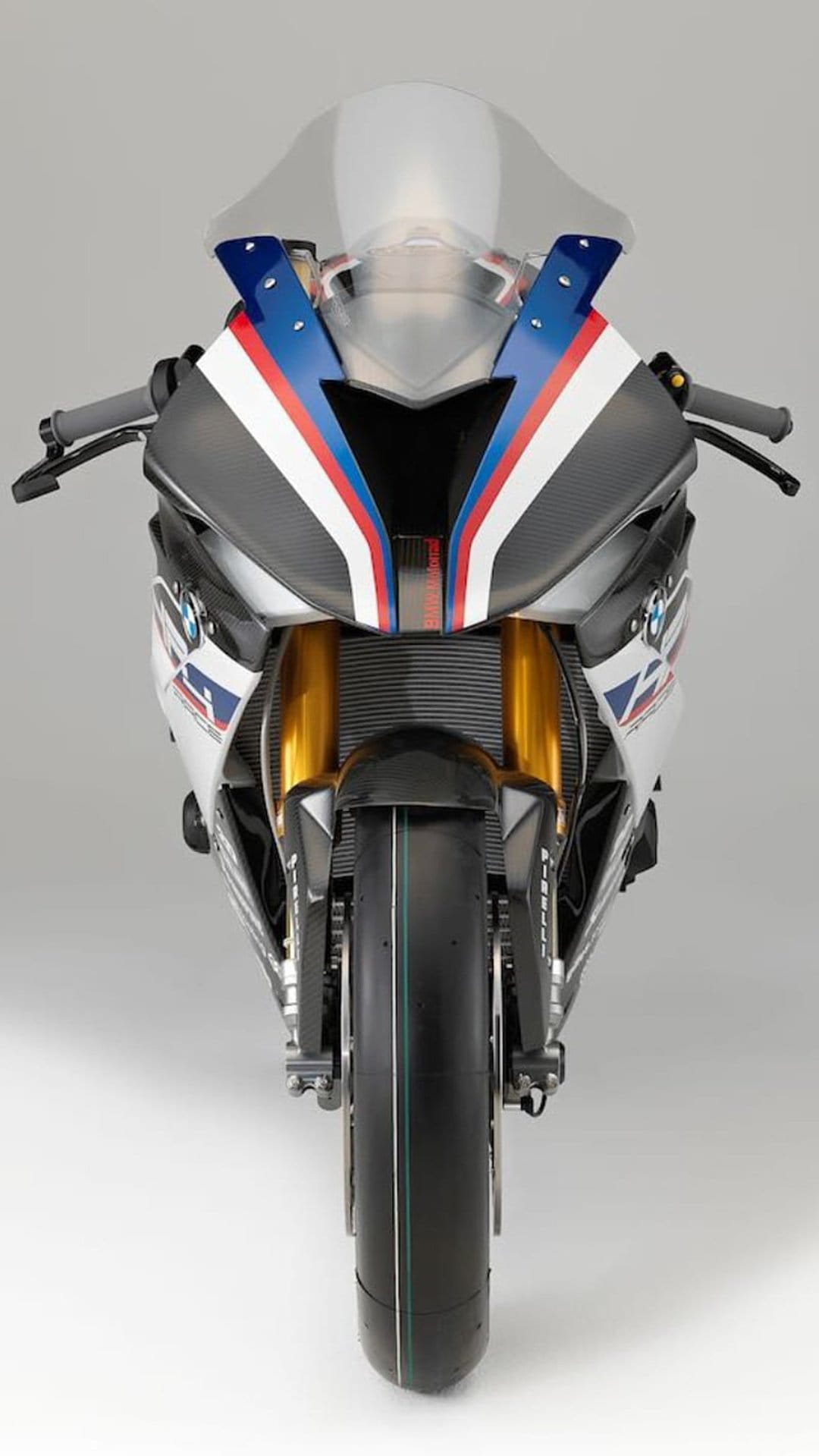 BMW M 1000 RR motorcycle front fairing with carbon fiber textures, gold front forks, and M Motorsport livery.