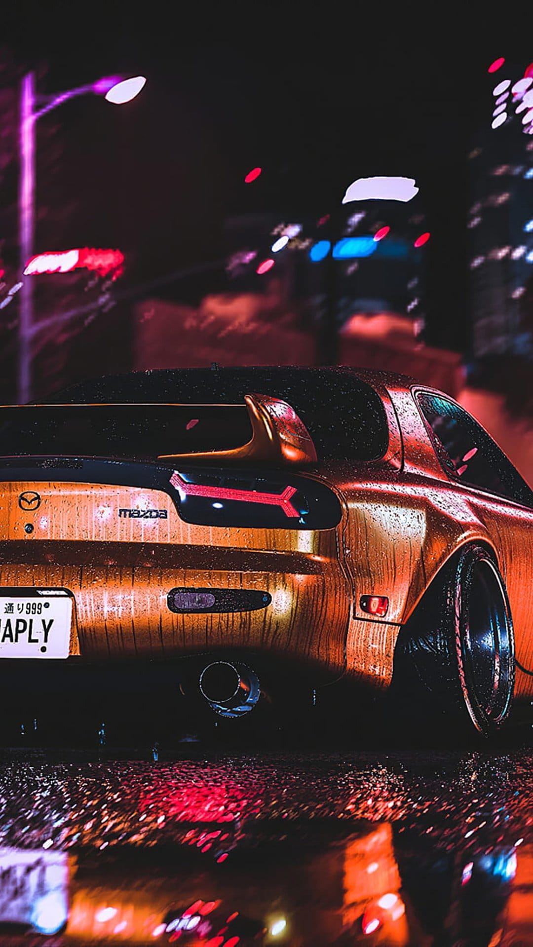 Mazda RX-7 with golden paint sits on a wet city street at night with glowing red taillights and neon reflections.