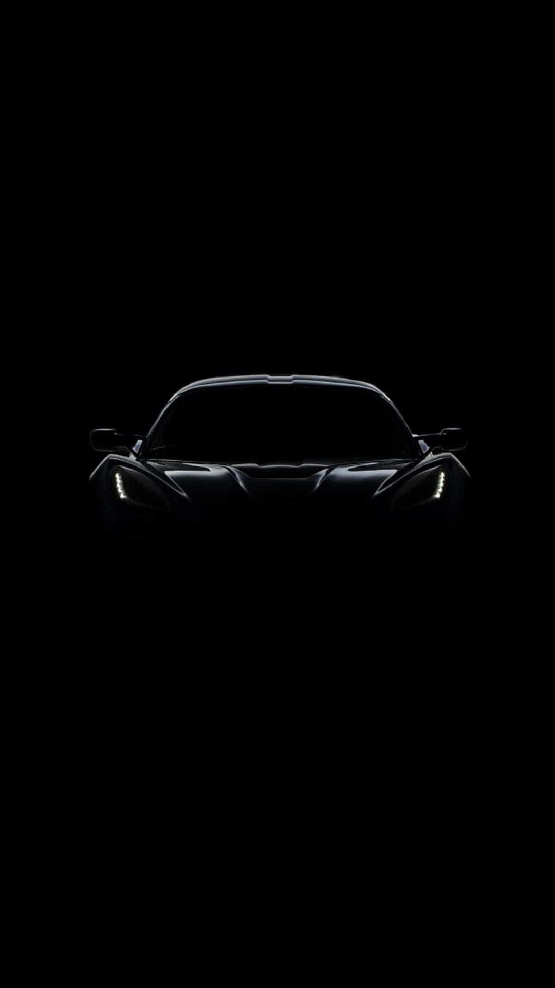 Sports car silhouette with glowing LED headlights and subtle body outlines against a solid black background.