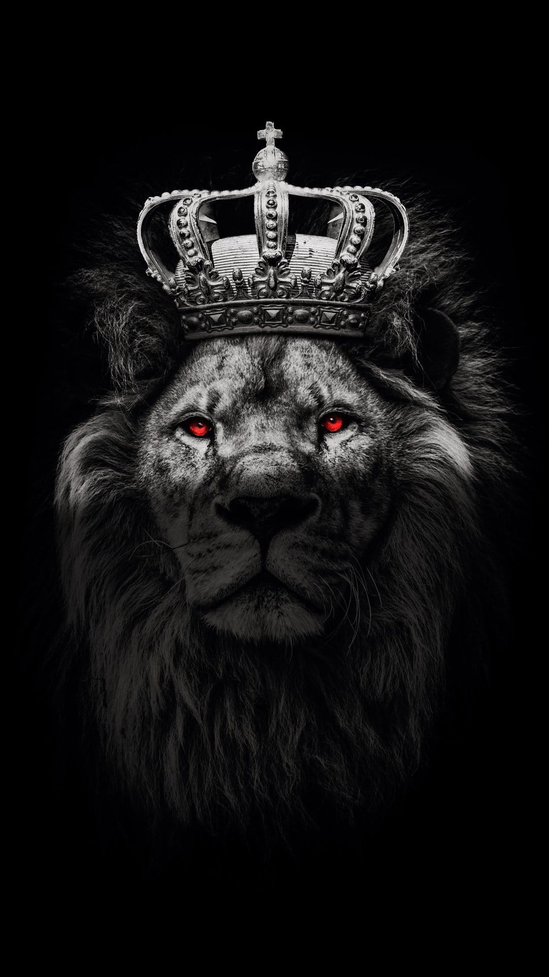 Lion king wearing a silver crown with glowing red eyes and a dark mane against a solid black background.