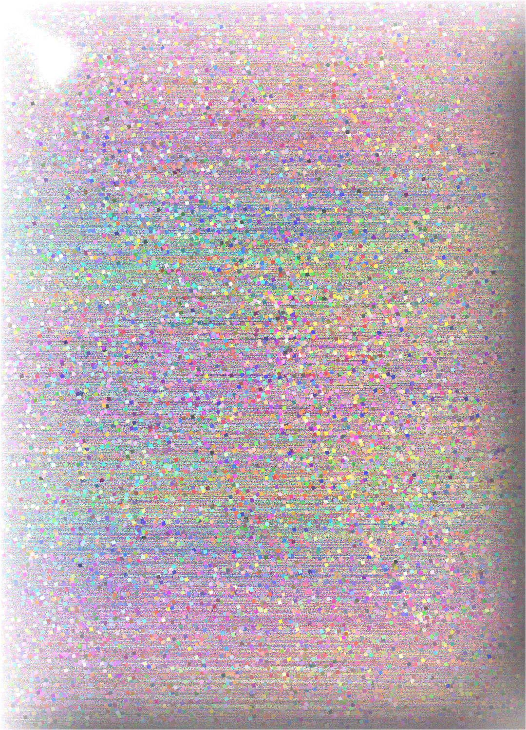 Prismatic glitter particles scatter across a dark metallic surface reflecting tiny rainbow light spectrums.