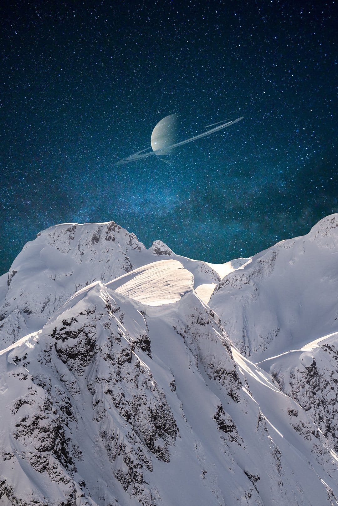Saturn with visible rings hangs over jagged, snow-dusted mountain peaks under a dense, starry night sky.