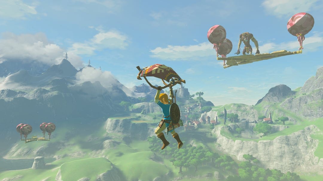 Link paragliding over green hills toward Hateno Village with a Bokoblin on a floating balloon platform nearby.