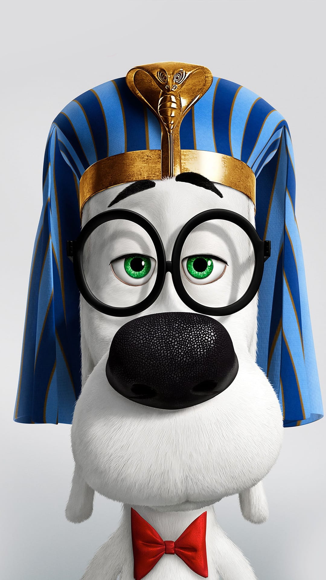 Mr. Peabody the dog wearing a blue and gold pharaoh headdress, black glasses, and a red bowtie in a close-up.