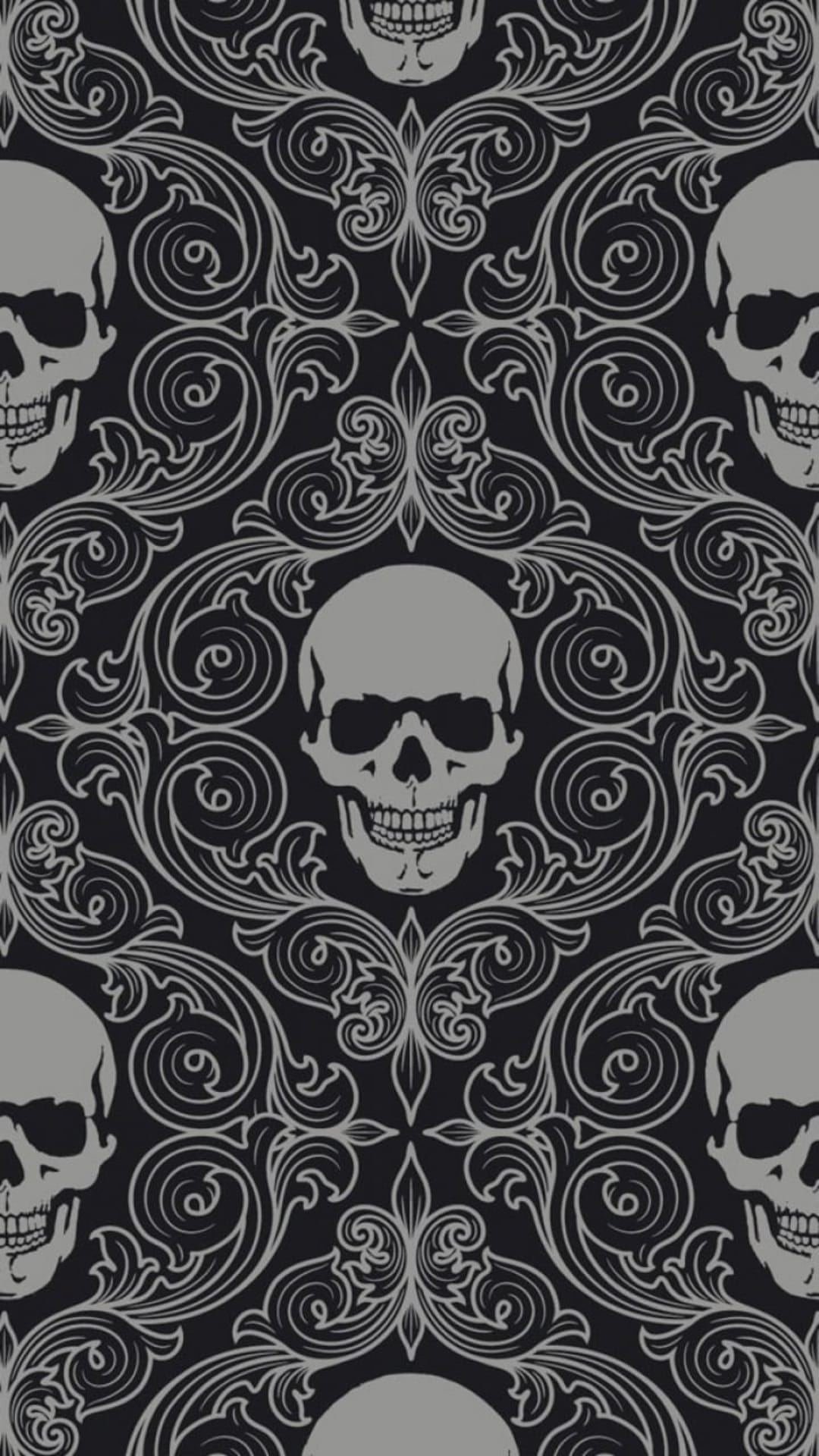 Grey gothic skulls nestled among intricate black damask swirls and baroque floral filigree in a repeating pattern.