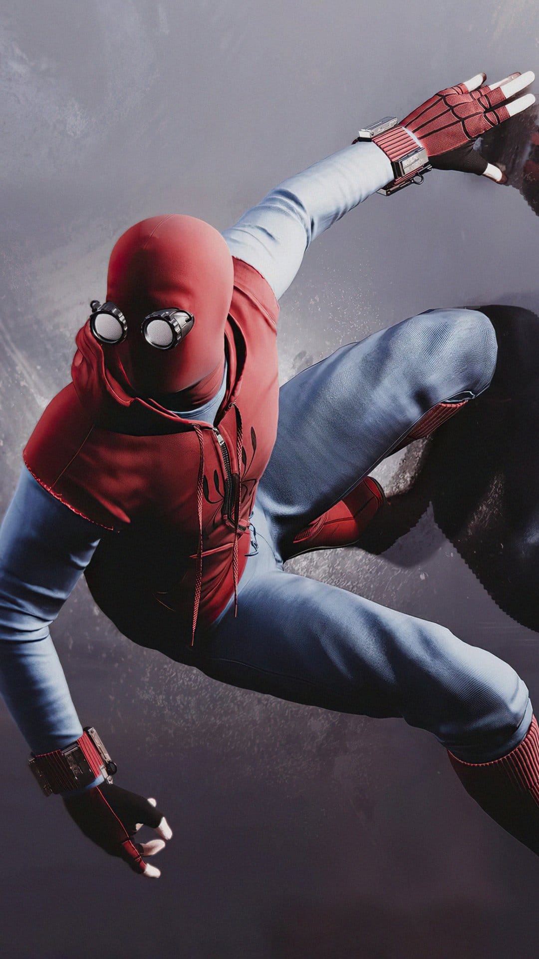Spider-Man in a red hooded vest and blue pants crouches mid-air wearing mechanical goggles and web shooters.