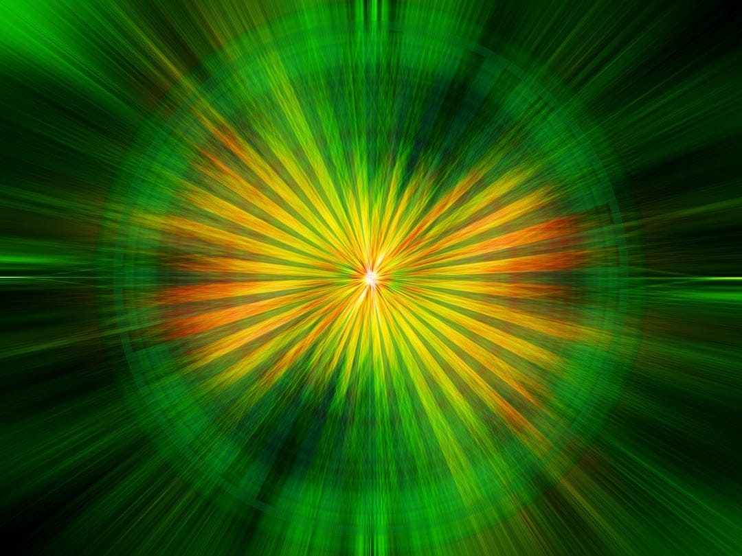 Luminous yellow rays and orange light shards radiating from a central point onto a deep emerald green surface.