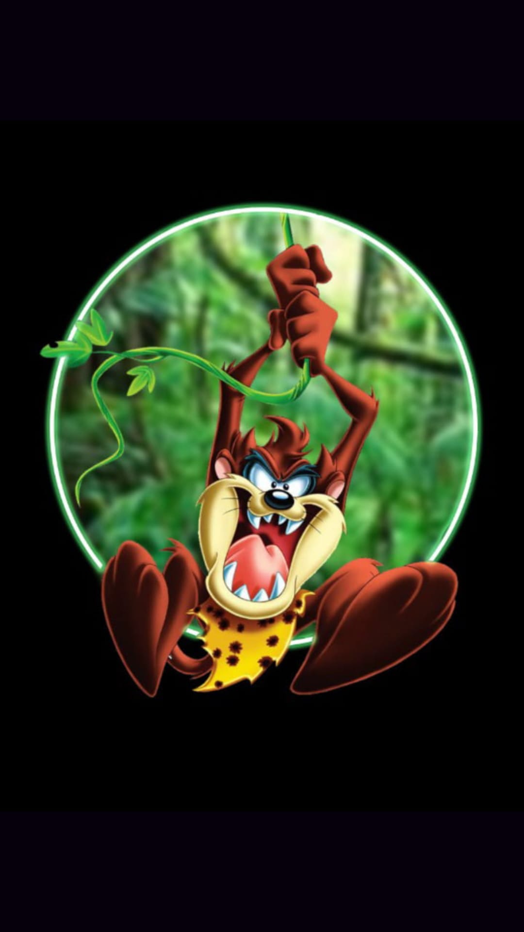 Taz the Tasmanian Devil swings on a vine inside a green circle against a black background with jungle plants.