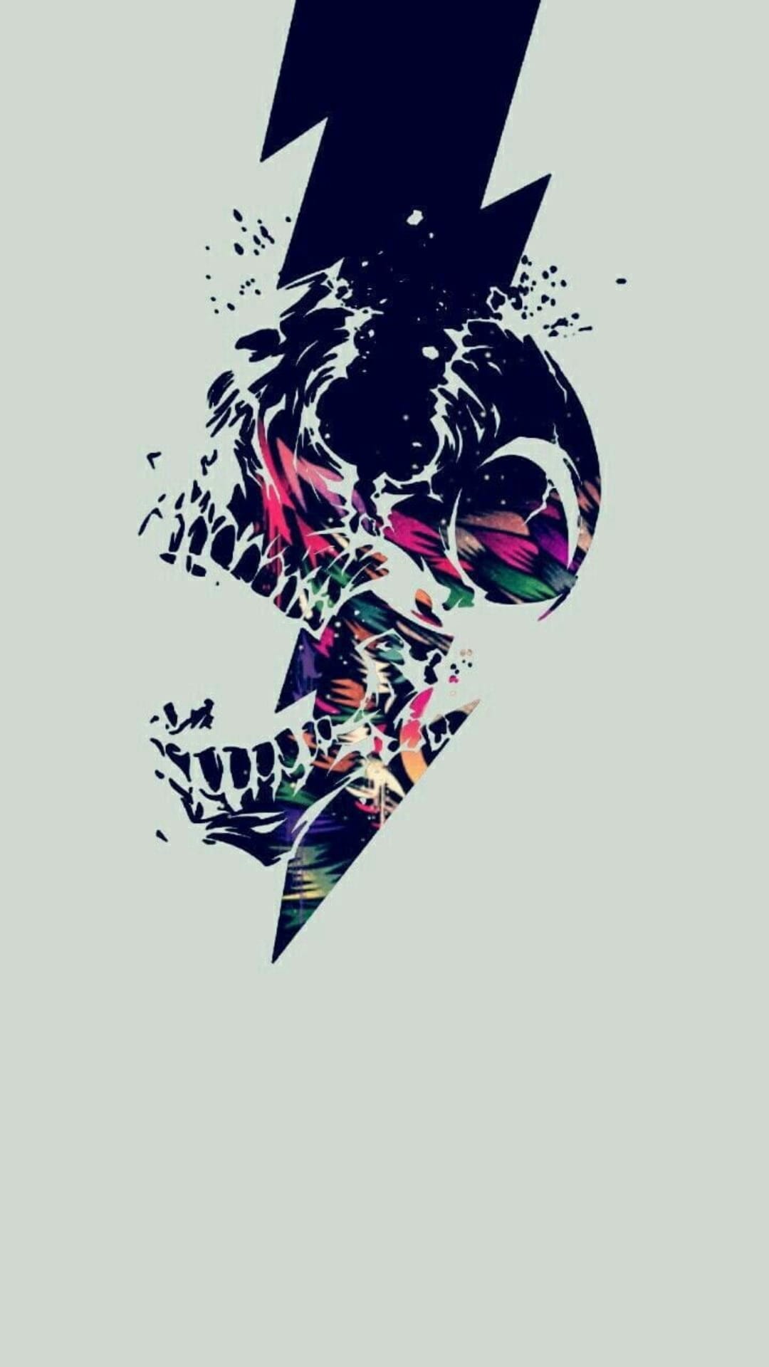 Human skull containing colorful tropical leaves is split by a glowing blue lightning bolt on a dark background.