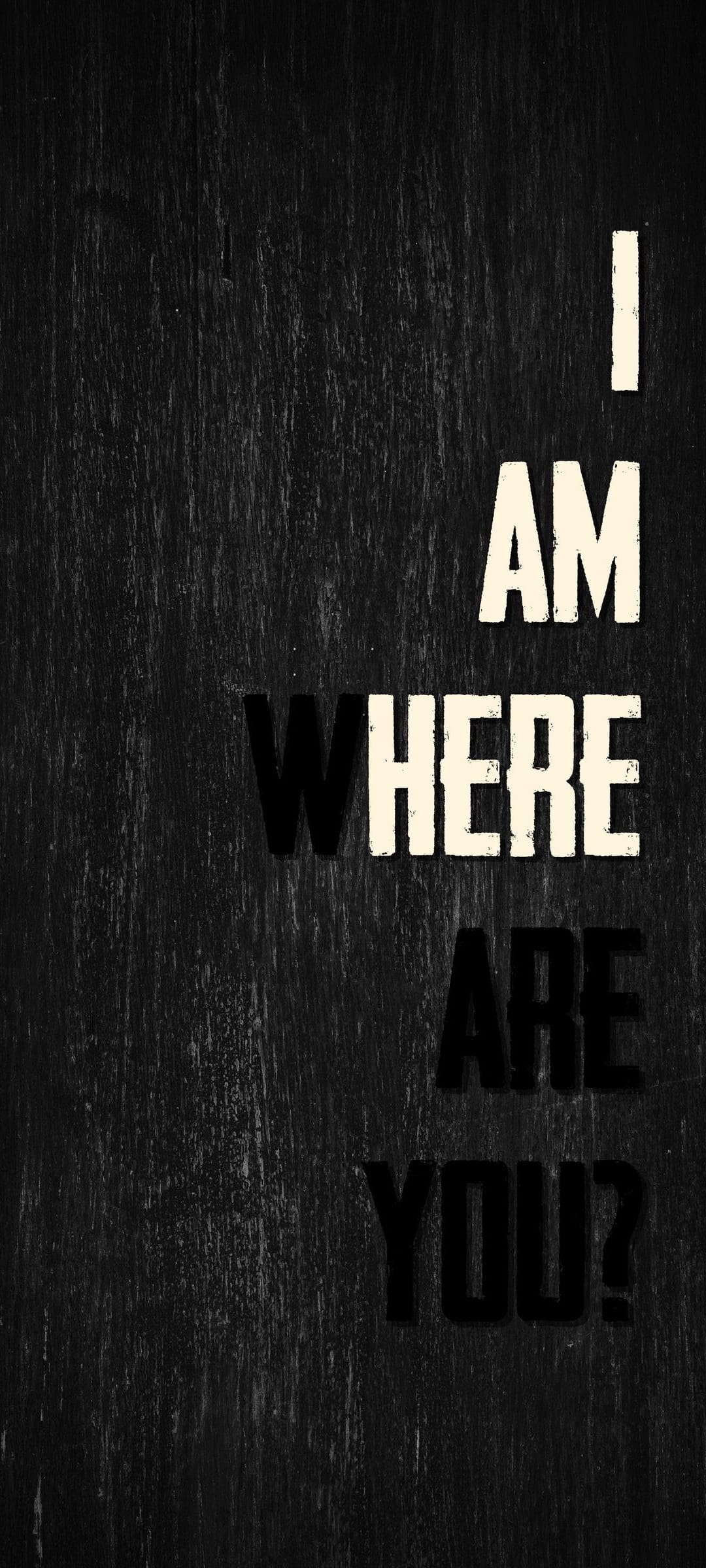 Bold distressed text reading I Am Where Are You centered on a dark shadowed wood grain textured background.