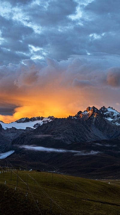Mountains, sunset, sunrise, snow, vibrant, dramatic, clouds, landscape, nature, alpine, peaceful, serene, powerful, travel, remote, beautiful, peak, rocky, glowing, high-altitude