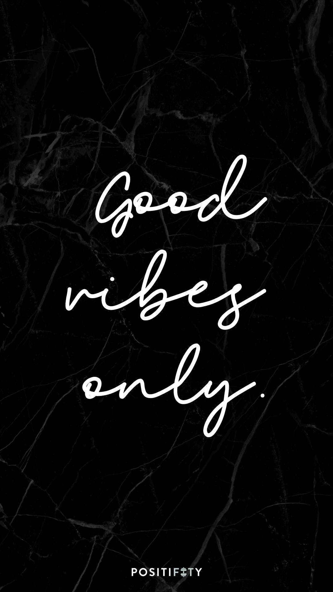 White script text reading Good Vibes Only centered on a dark black marble background with gray veins.
