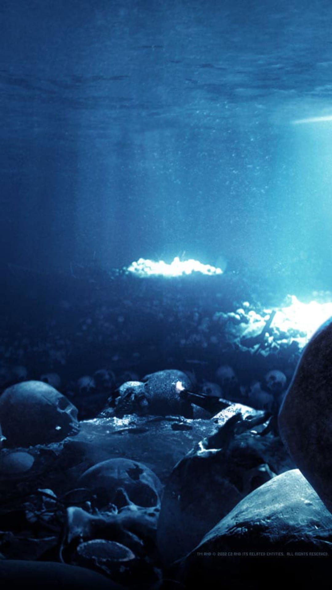 Human skulls and bones lie on a sandy seabed beneath shafts of ghostly blue light in a deep underwater abyss.