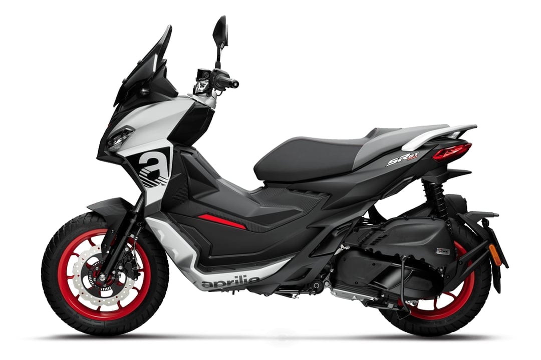 Aprilia SR GT scooter with white bodywork, red rims, and a black seat against a white studio background.