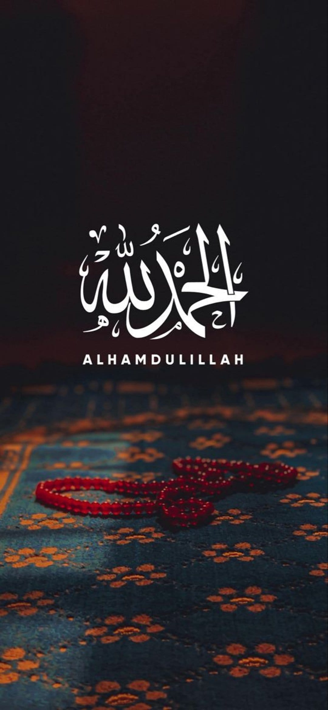 White Arabic calligraphy positioned above crimson prayer beads on a teal floral rug with soft lighting.